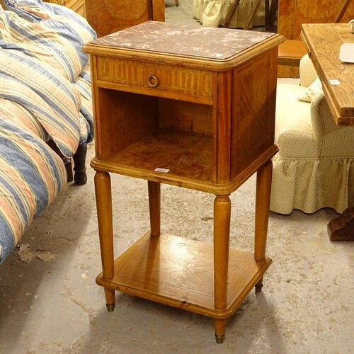 A French walnut and satinwood-banded marble-top bedside cabi...