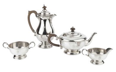 A George V silver three piece tea service, with beaded...