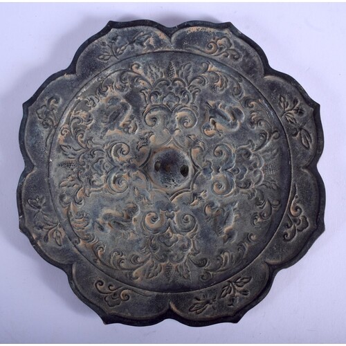 A LARGE CHINESE BRONZE HAND MIRROR 20th Century, decorated w...