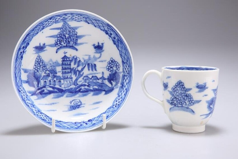 A LATE CAUGHLEY BLUE AND WHITE CUP AND SAUCER