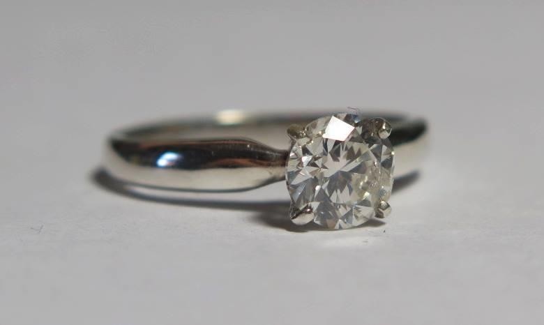 A Modern 18ct White Gold Diamond Solitaire Ring, size L.5, 2...