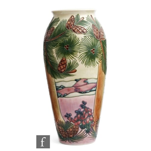 A Moorcroft Pottery vase decorated in the Furzy Hill pattern...