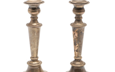 A PAIR OF FILLED SILVER BALUSTER CANDLESTICKS.