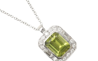 A PERIDOT AND DIAMOND CLUSTER PENDANT. the rounded rectangul...