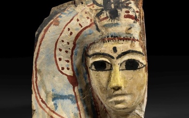 A Ptolemaic wooden mask of a mummy.
