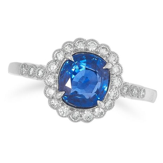 A SAPPHIRE AND DIAMOND CLUSTER RING set with a cushion