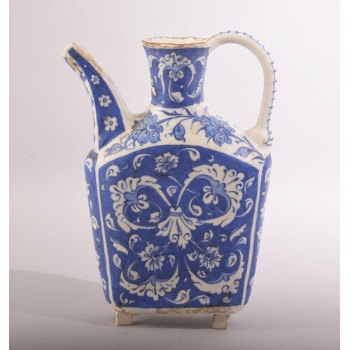 A SMALL TURKISK BLUE AND WHITE KUTAHYA WATER JUG, with spray...