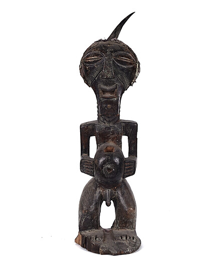A SONGYE MALE POWER FIGURE, CARVED WOOD, APPLIED METAL, ANIMAL SKIN AND HORN, DEMOCRATIC REPUBLIC OF CONGO