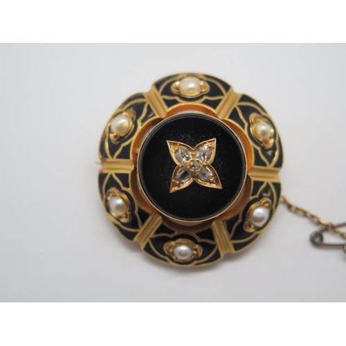 A Victorian gold diamond and pearl brooch set with black ena...