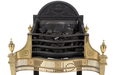 A brass and cast iron fire grate in George III Adam style