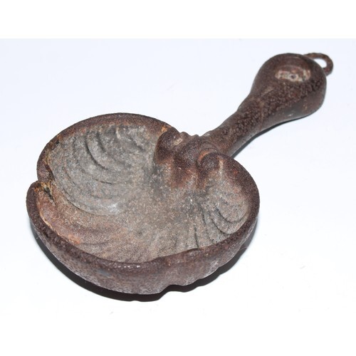 A cast iron water scoop, shell bowl, 21.5cm long