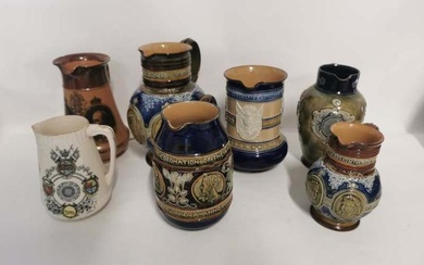 A collection of Queen Victoria and later commemorative jugs to...