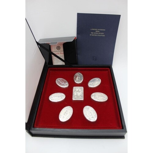 A collection of seven oval silver boxes, the removable lids ...