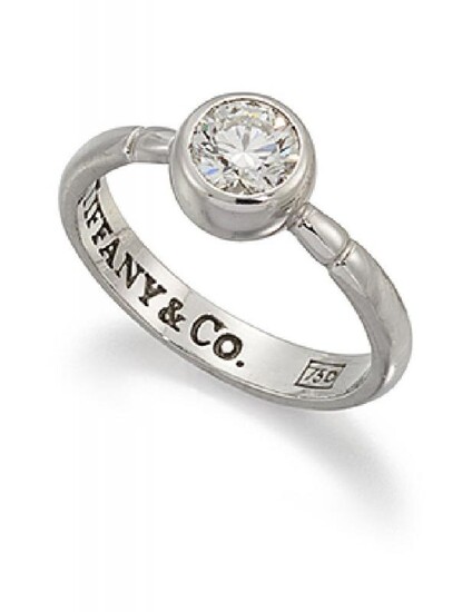 A diamond single stone ring by Tiffany...