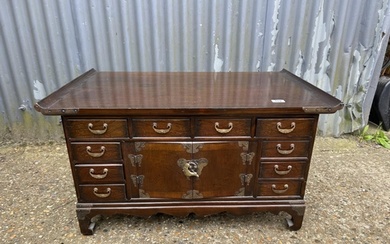 A double sided oriental hardwood coffee table with drawers a...