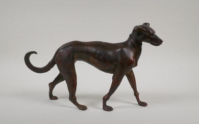 A filled bronze figure of a dog with gilt...