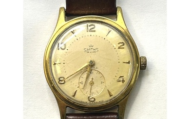 A gentleman's Smiths Deluxe wristwatch, on an associated lea...