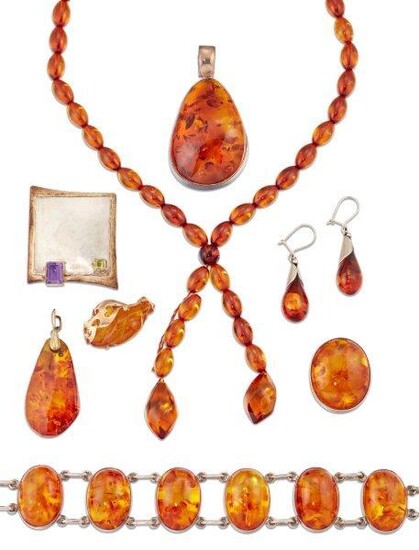 A group of amber jewellery, including: a heat treated amber panel necklace, two pendants, ring, brooch, necklace and earrings; (necklace detached); and an amethyst and peridot brooch (a lot)
