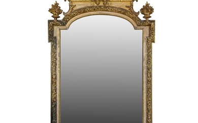 A large Louis XV style parcel gilt and gessoed wood mirror
