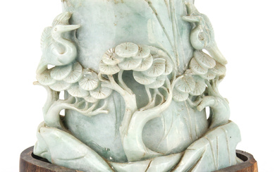 A large carved pale green jade brush pot, with rolling...