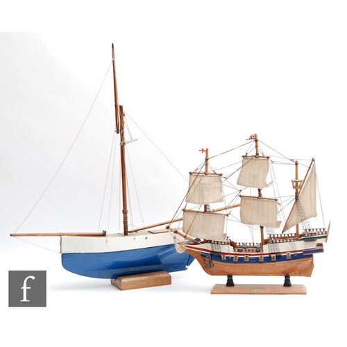A mid 20th Century wooden pond yacht with painted blue and w...