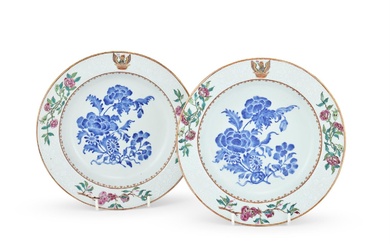 A pair of Chinese Export Famille Rose crested soup bowls
