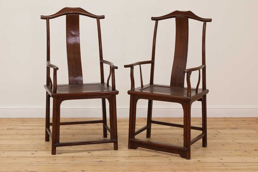 A pair of Chinese yokeback armchairs