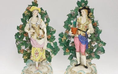 A pair of Continental porcelain figures of gardeners, pseudo...