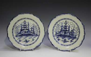 A pair of English pearlware plates, circa 1790, each painted in blue with a chinoiserie pagoda withi