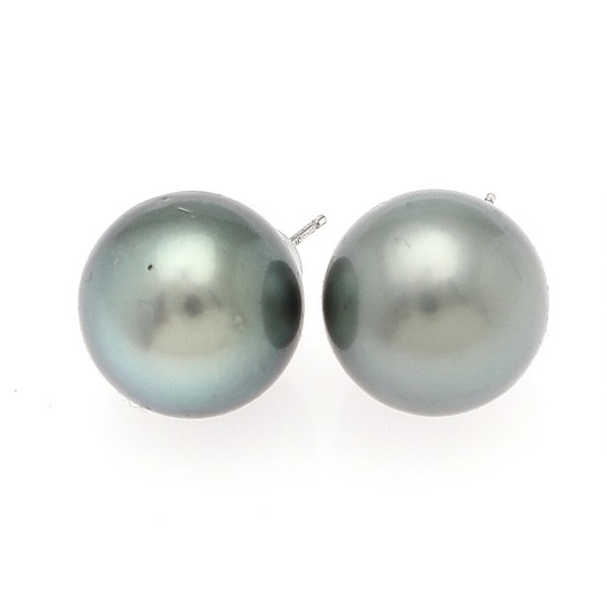 A pair of Tahiti pearl ear studs each set with a cultured Tahiti pearl, mounted in 14k white gold. Diam. app. 13.7 mm. (2)