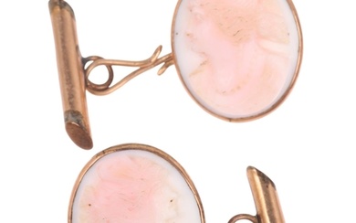 A pair of early 20th century pink coral cameo cufflinks, rel...