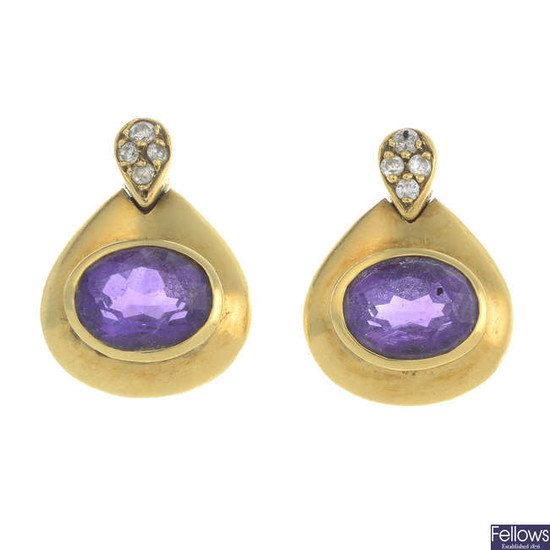 A pair of oval-shape amethyst and brilliant-cut diamond earrings.