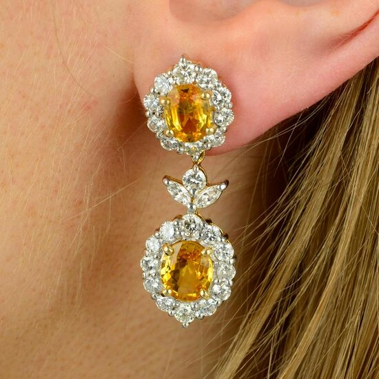 A pair of yellow sapphire and vari-cut diamond floral