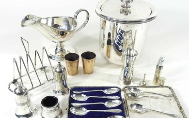 A set of ten silver teaspoons, of golfing interest, together...