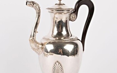 A silver pot (1819-1838) in the form of a baluster resting on three arched feet ending in lion claws and surmounted by wide palms, the body plain, the shoulder hemmed with a frieze of heart stripes, the beak in the shape of a duck's head and...