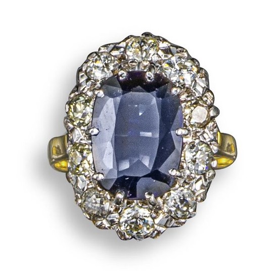 A synthetic sapphire and diamond cluster ring, the...
