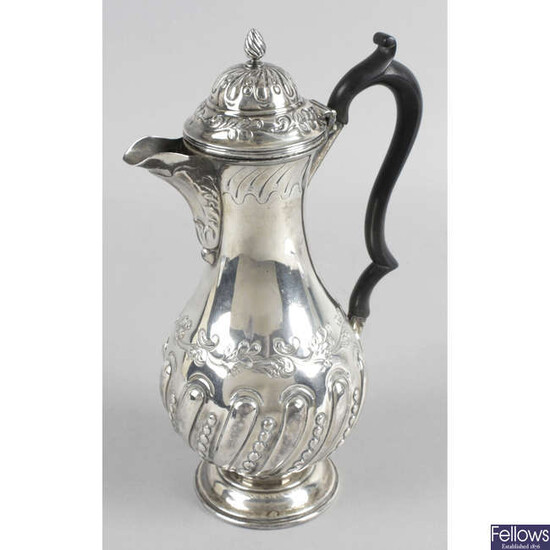 A turn of the century silver hot water pot.