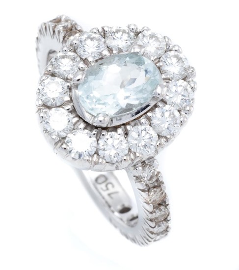 AN 18CT WHITE GOLD AQUAMARINE AND DIAMOND CLUSTER RING; centring an approx. 0.70ct aquamarine to surround and shoulders set with 30...