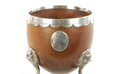 AN 18TH CENTURY SILVER MOUNTED CARVED COCONUT CUP with...