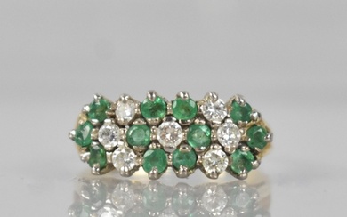 An 18ct Gold, Emerald and Diamond Cluster Ring Comprising Se...