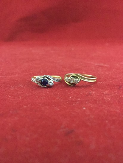 An 18ct gold ring, set with a diamond and sapphire twist and...