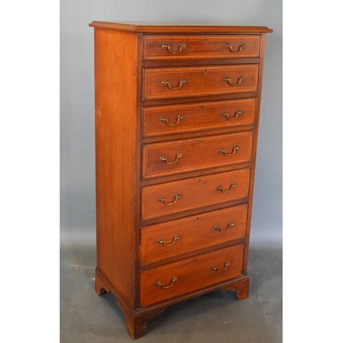 An Edwardian Mahogany Chest, the moulded top above seven dra...