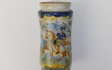An antique maiolica albarello, painted with a landscape panel...