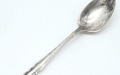 An antique sterling silver teaspoon with full Sheffield...