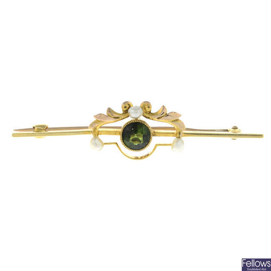 An early 20th century 15ct gold green tourmaline and seed pearl brooch.