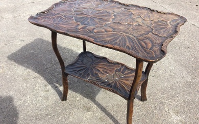 An early C20th Japanese hardwood occasional table with shaped rectangular...
