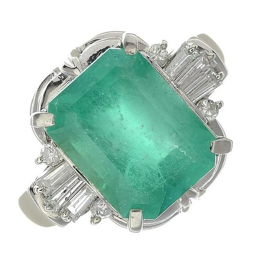 An emerald and diamond ring dress ring.Emerald weight