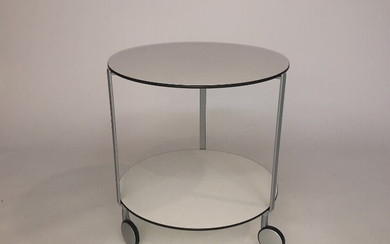SOLD. Anna Deplano: "Girò". A castor-mounted coffee table with steel frame, white laminate top. H....