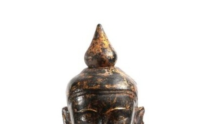 Buddha head in black lacquered sandstone. Burma, 19th...