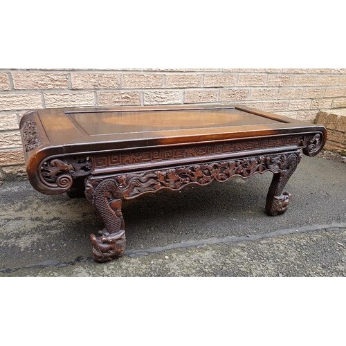 Carved Chinese Wooden Table with scrolled ends, decorated wi...